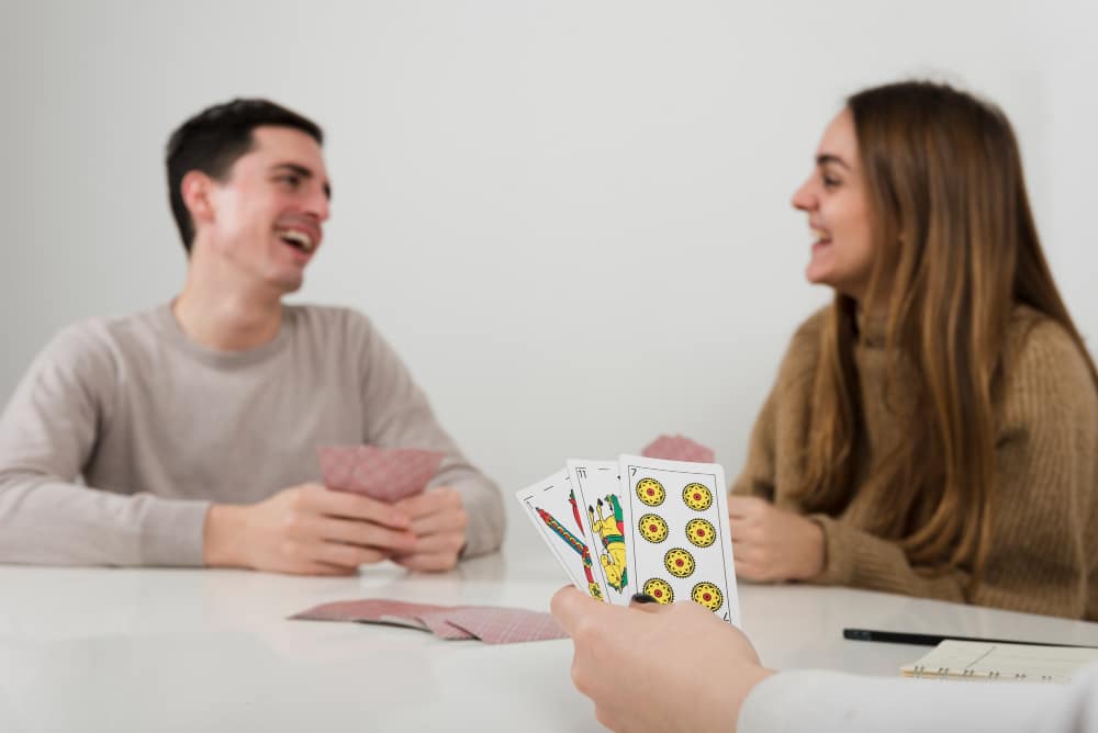 close-up-friends-playing-cards-game