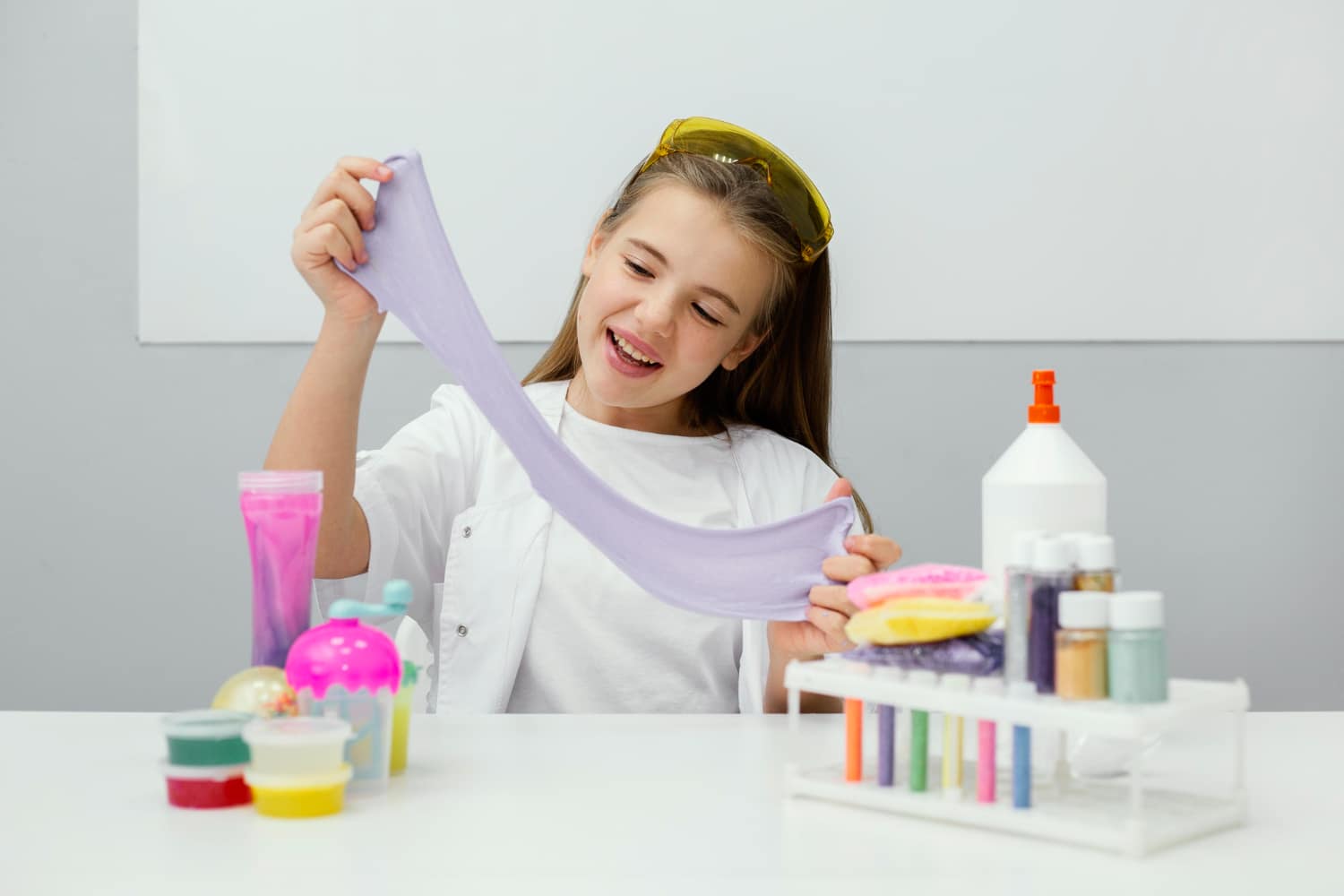 smiley-young-girl-scientist-making-slime